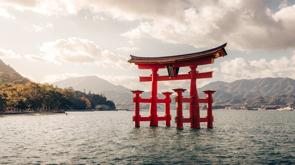 Serene view of the iconic floating Torii Gate of Itsukushima Shrine in Miyajima, Japan.